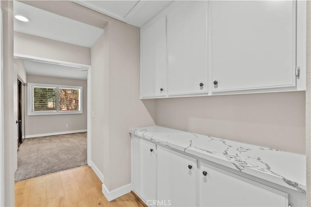 26337 Rainbow Glen Dr Unit 244, Newhall, CA 91321 - laundry area with light wood-style floors and baseboards