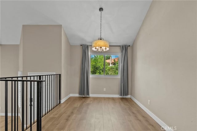 26337 Rainbow Glen Dr Unit 244, Newhall, CA 91321 - unfurnished room featuring a chandelier and light wood finished floors