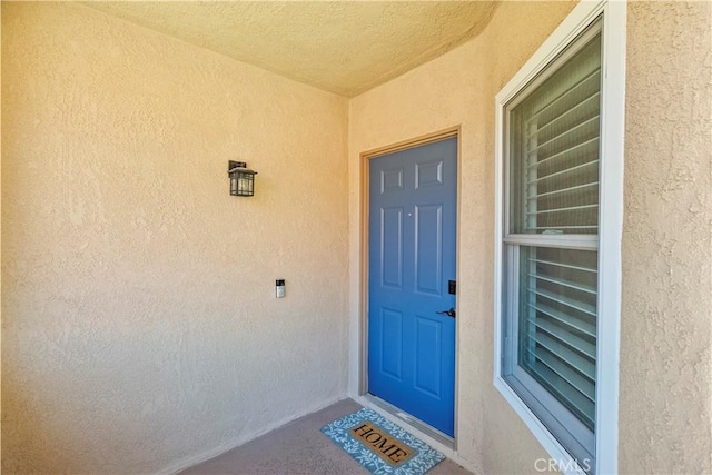 26337 Rainbow Glen Dr Unit 244, Newhall, CA 91321 - view of exterior entry featuring stucco siding