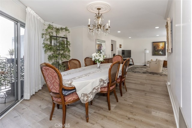 1118 N Central Ave Unit 14, Glendale, CA 91202 - dining area with a chandelier, light wood finished floors, crown molding, and recessed lighting
