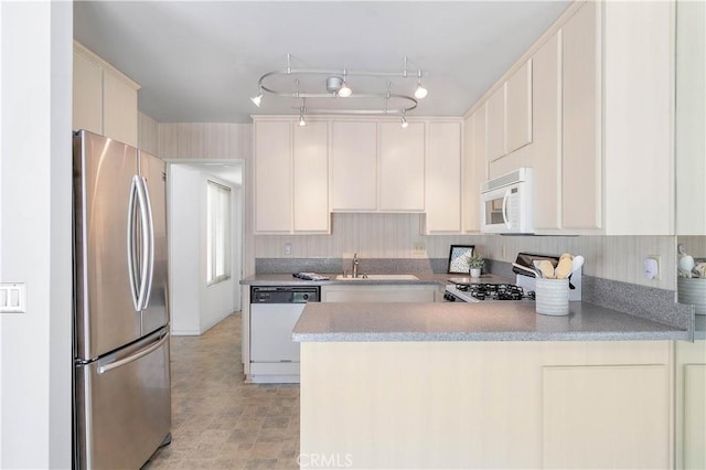 810 E Laurel Oak Dr, Azusa, CA 91702 - kitchen with white appliances, a peninsula, light countertops, and cream cabinets