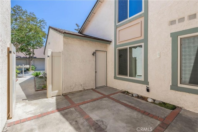 810 E Laurel Oak Dr, Azusa, CA 91702 - view of home's exterior featuring stucco siding and a patio area