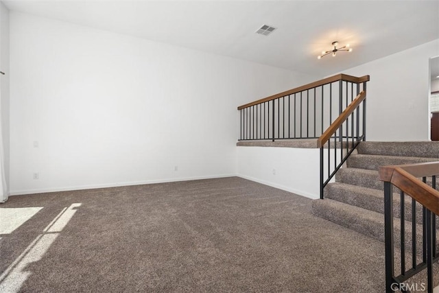 10 Starfall Unit 11, Irvine, CA 92603 - unfurnished living room with carpet flooring and stairs
