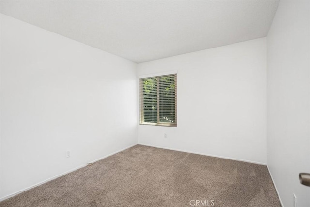 10 Starfall Unit 11, Irvine, CA 92603 - unfurnished room featuring carpet flooring