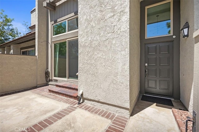 10 Starfall Unit 11, Irvine, CA 92603 - doorway to property with stucco siding