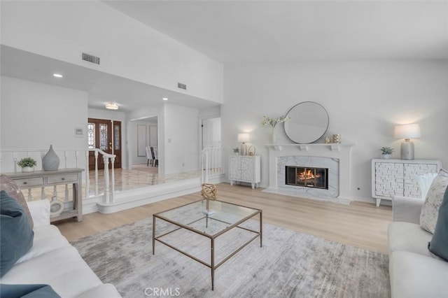 21 Santa Catalina Dr, Rancho Palos Verdes, CA 90275 - living room featuring wood finished floors, a fireplace, vaulted ceiling, and recessed lighting