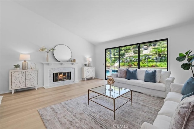 21 Santa Catalina Dr, Rancho Palos Verdes, CA 90275 - living room featuring vaulted ceiling, wood finished floors, and a premium fireplace