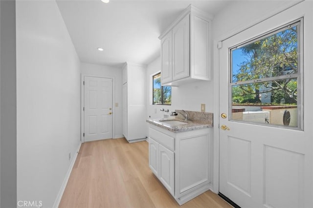 21 Santa Catalina Dr, Rancho Palos Verdes, CA 90275 - kitchen featuring white cabinets, light wood-type flooring, recessed lighting, and light stone counters