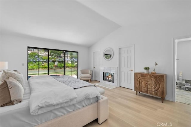 21 Santa Catalina Dr, Rancho Palos Verdes, CA 90275 - bedroom featuring access to exterior, lofted ceiling, light wood-style floors, and a fireplace