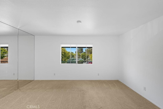 232 Villa Point Dr, Newport Beach, CA 92660 - spare room featuring carpet flooring, plenty of natural light, and a smoke detector
