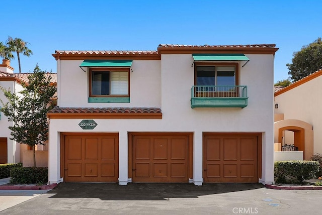 232 Villa Point Dr, Newport Beach, CA 92660 - mediterranean / spanish home with stucco siding, a garage, and a tile roof