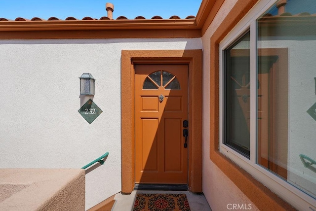 232 Villa Point Dr, Newport Beach, CA 92660 - view of exterior entry featuring stucco siding