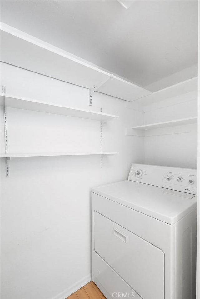 232 Villa Point Dr, Newport Beach, CA 92660 - laundry area with washer / dryer and light wood finished floors