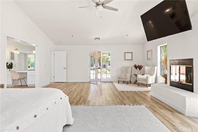 35356 Sierra Vista Dr, Agua Dulce, CA 91390 - bedroom featuring access to exterior, light wood finished floors, multiple windows, and vaulted ceiling