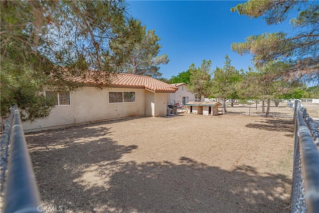 35356 Sierra Vista Dr, Agua Dulce, CA 91390 - back of property with stucco siding and a tile roof