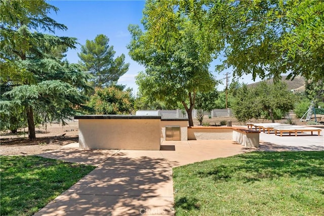 35356 Sierra Vista Dr, Agua Dulce, CA 91390 - view of front of property featuring stucco siding, an outdoor kitchen, a patio area, and a front yard