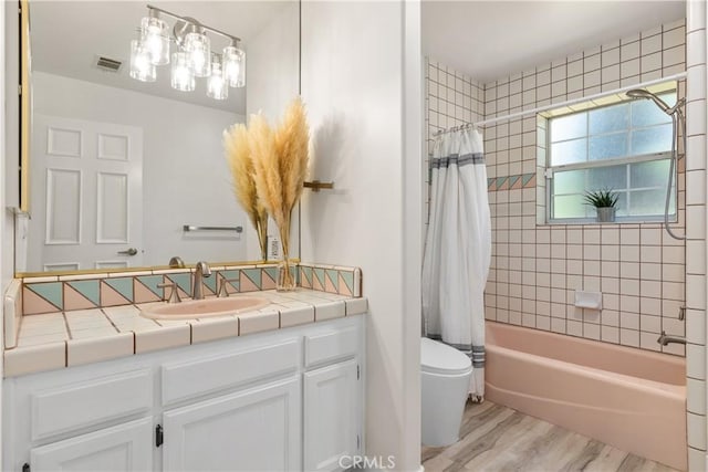 35356 Sierra Vista Dr, Agua Dulce, CA 91390 - bathroom with vanity, wood finished floors, and shower / tub combo