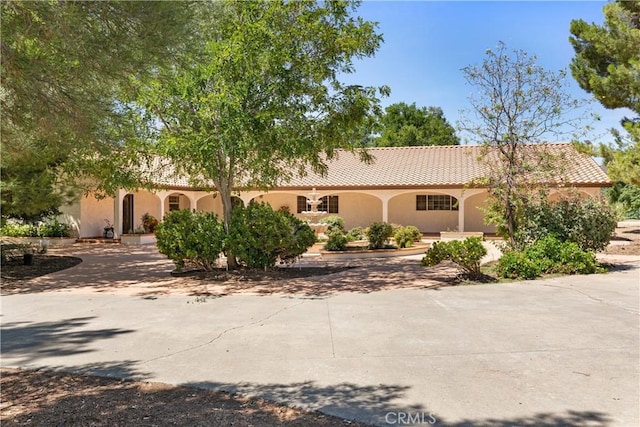 35356 Sierra Vista Dr, Agua Dulce, CA 91390 - mediterranean / spanish-style house featuring stucco siding, curved driveway, and a tiled roof