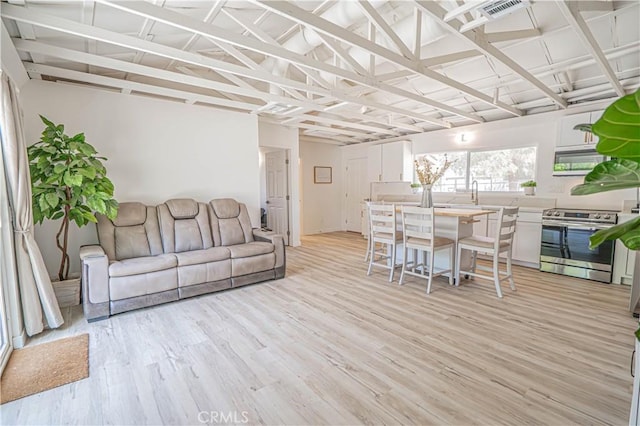 35356 Sierra Vista Dr, Agua Dulce, CA 91390 - living area featuring light wood-style flooring and vaulted ceiling