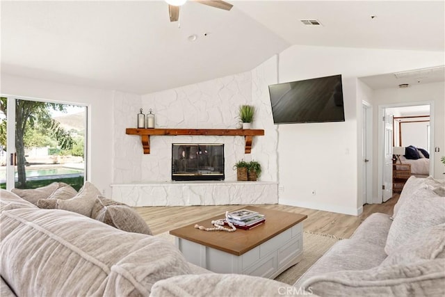 35356 Sierra Vista Dr, Agua Dulce, CA 91390 - living area featuring lofted ceiling, light wood-type flooring, a fireplace, and a ceiling fan