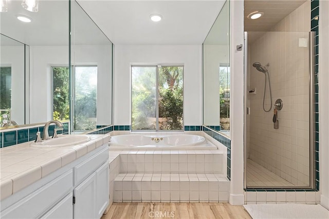 35356 Sierra Vista Dr, Agua Dulce, CA 91390 - full bath featuring a stall shower, vanity, a bath, wood finished floors, and recessed lighting
