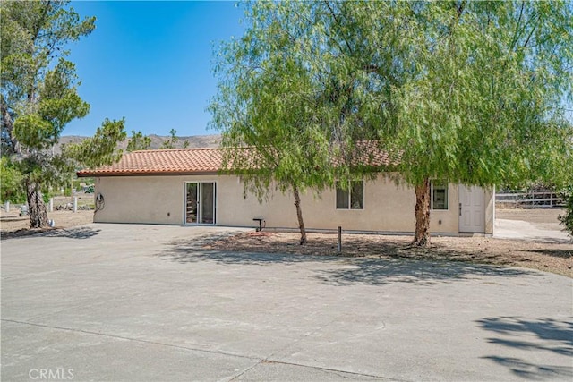 35356 Sierra Vista Dr, Agua Dulce, CA 91390 - rear view of house with stucco siding and a tile roof