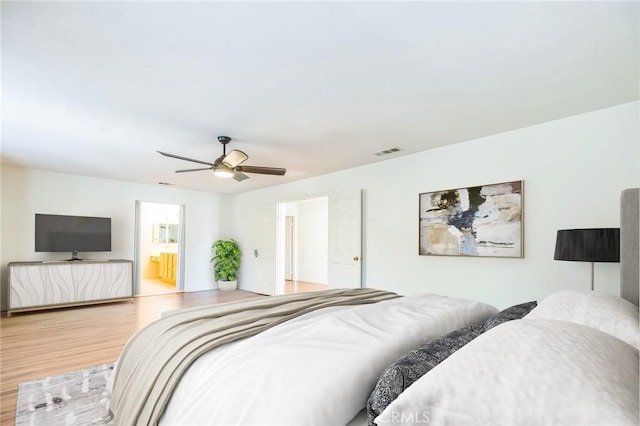 1030 Benedict Cir, Corona, CA 92882 - bedroom featuring wood finished floors, ceiling fan, and ensuite bath