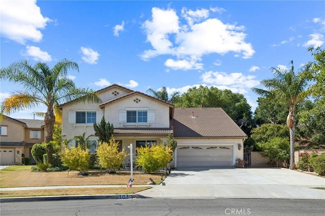 1030 Benedict Cir, Corona, CA 92882 - mediterranean / spanish-style house with concrete driveway, stucco siding, an attached garage, and a tiled roof