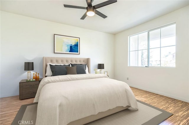 1030 Benedict Cir, Corona, CA 92882 - bedroom with wood finished floors and a ceiling fan