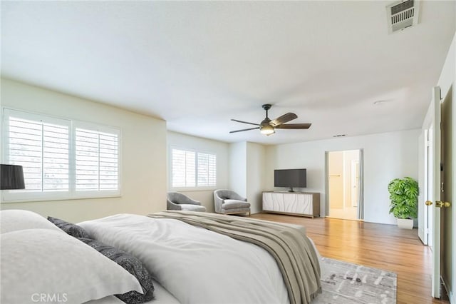 1030 Benedict Cir, Corona, CA 92882 - bedroom with wood finished floors and ceiling fan