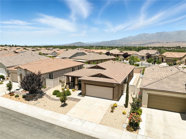 1616 Rosemary, Beaumont, CA 92223 - view of front of home featuring a residential view, a tiled roof, stucco siding, a garage, and driveway