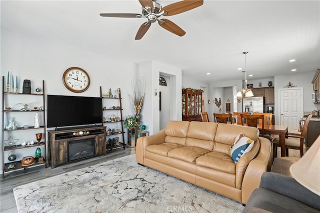 1616 Rosemary, Beaumont, CA 92223 - living area featuring light wood-type flooring, ceiling fan, recessed lighting, and a glass covered fireplace
