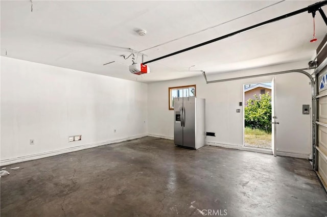 6681 Rostrata Ave, Buena Park, CA 90621 - garage with stainless steel fridge with ice dispenser and a garage door opener