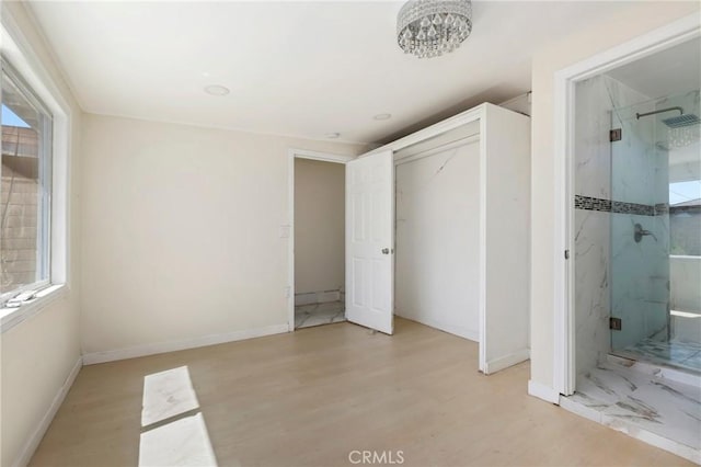6681 Rostrata Ave, Buena Park, CA 90621 - unfurnished bedroom with light wood finished floors, ensuite bath, and a closet