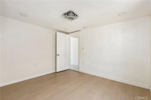 6681 Rostrata Ave, Buena Park, CA 90621 - empty room featuring light wood-style floors and baseboards