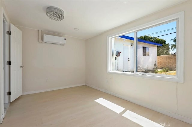 6681 Rostrata Ave, Buena Park, CA 90621 - unfurnished room featuring a wall unit AC and wood finished floors