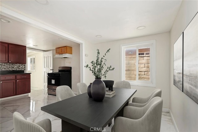6681 Rostrata Ave, Buena Park, CA 90621 - dining area featuring light marble finish flooring and recessed lighting