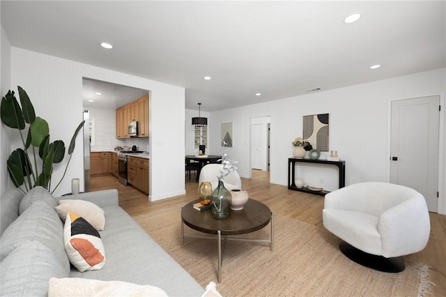 2231 Ocana Ave, Long Beach, CA 90815 - living area with light wood-type flooring and recessed lighting