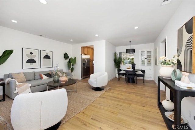 2231 Ocana Ave, Long Beach, CA 90815 - living area featuring light wood-style floors and recessed lighting