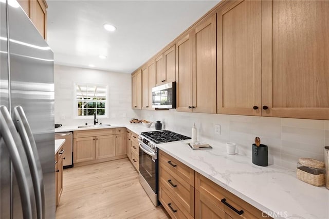 2231 Ocana Ave, Long Beach, CA 90815 - kitchen with appliances with stainless steel finishes, light wood finished floors, backsplash, light brown cabinetry, and recessed lighting