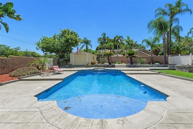 2531 Wildcat Ln, Riverside, CA 92503 - view of pool featuring a patio, a fenced backyard, a shed, and a pool with connected hot tub