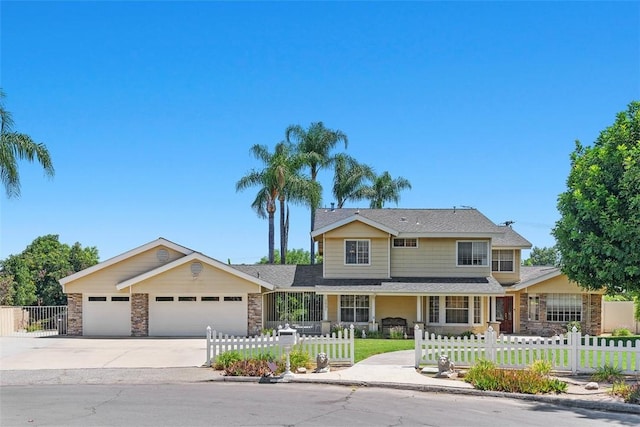 2531 Wildcat Ln, Riverside, CA 92503 - traditional home with a fenced front yard, stone siding, an attached garage, and concrete driveway