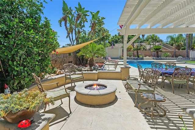 2531 Wildcat Ln, Riverside, CA 92503 - fenced backyard featuring an outdoor fire pit, a patio, a pergola, and a storage shed