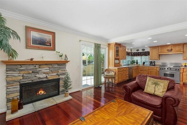 2531 Wildcat Ln, Riverside, CA 92503 - living area featuring dark wood-type flooring, a fireplace, crown molding, and recessed lighting
