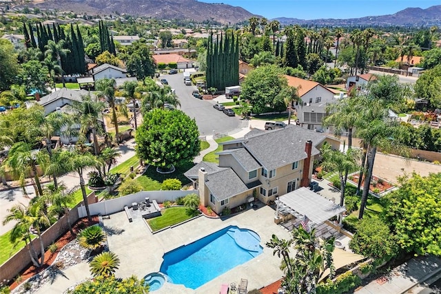 2531 Wildcat Ln, Riverside, CA 92503 - aerial perspective of suburban area with a pool area and mountains