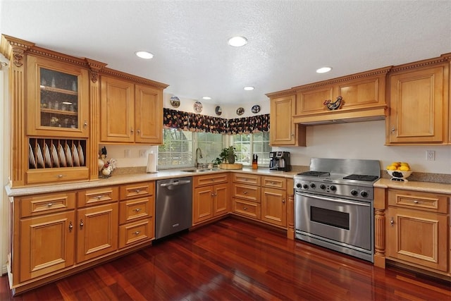 2531 Wildcat Ln, Riverside, CA 92503 - kitchen with stainless steel appliances, under cabinet range hood, dark wood-style floors, light countertops, and glass insert cabinets