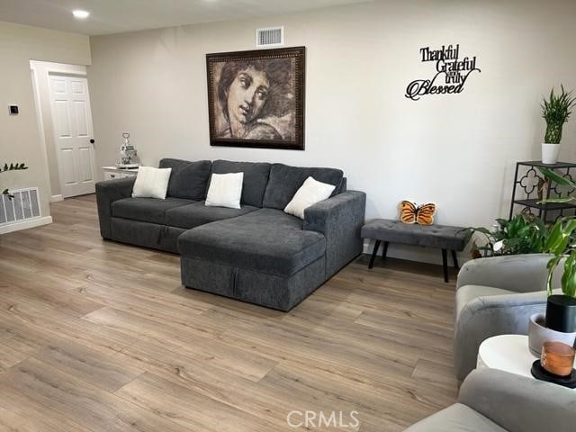 9827 Estacia Ct, Rancho Cucamonga, CA 91730 - living room featuring light wood-style floors and recessed lighting