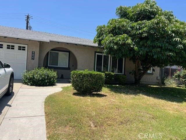9827 Estacia Ct, Rancho Cucamonga, CA 91730 - ranch-style home featuring stucco siding, an attached garage, a front lawn, and driveway