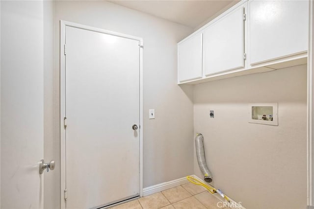 591 Shadow Tree Dr, Oceanside, CA 92058 - washroom with electric dryer hookup, washer hookup, cabinet space, and light tile patterned floors