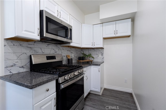 425 W 17th St, San Bernardino, CA 92405 - kitchen featuring stainless steel appliances, white cabinetry, dark wood-type flooring, and decorative backsplash